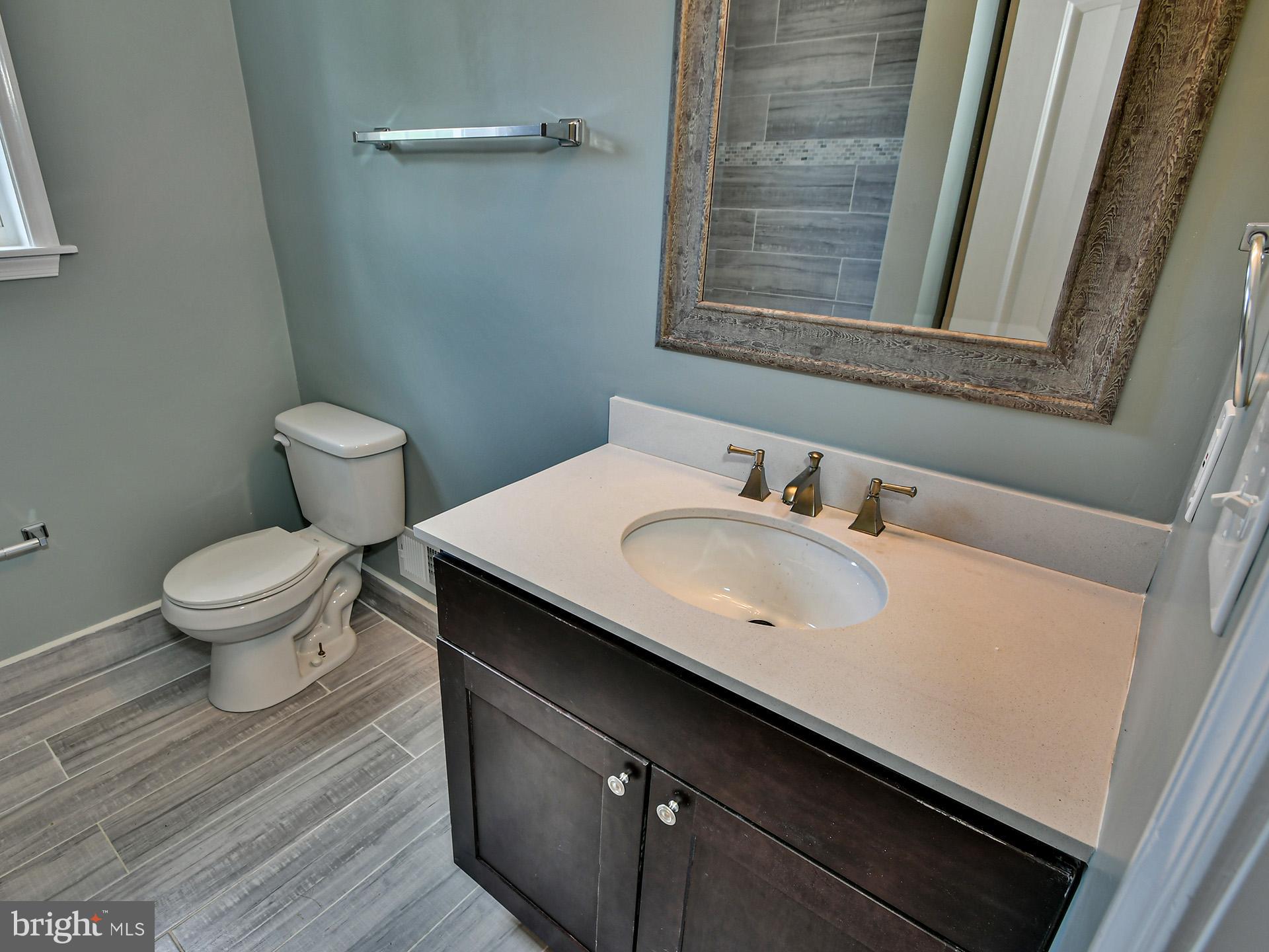 9303 Small Drive Clinton, MD 20735 - Photo 23 of 48 a bathroom with a sink and a toilet