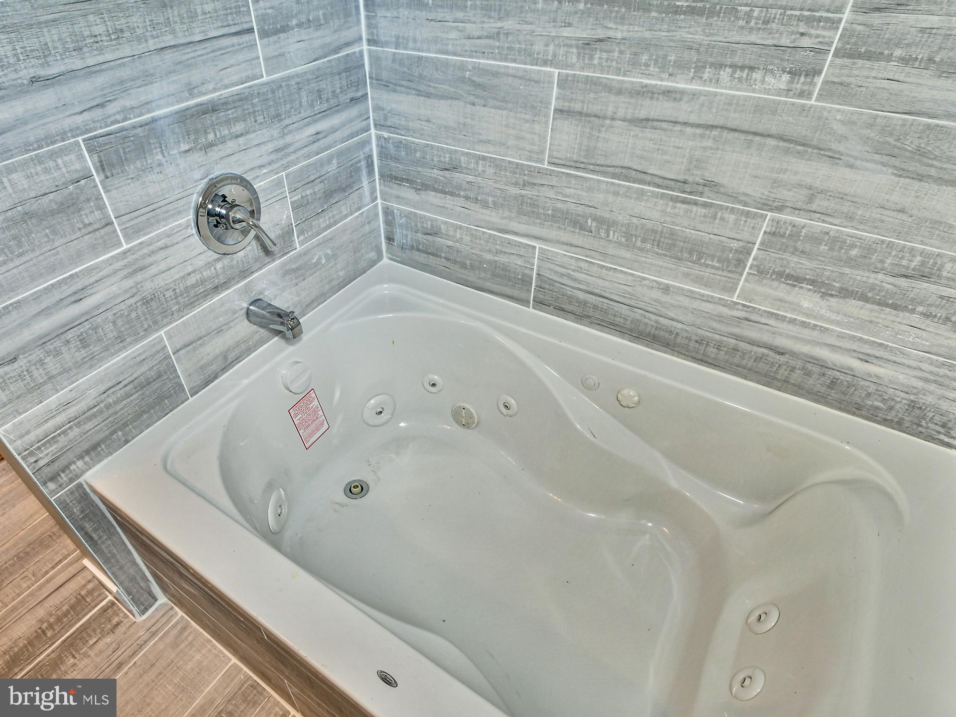 9303 Small Drive Clinton, MD 20735 - Photo 24 of 48 a bathroom with a bathtub