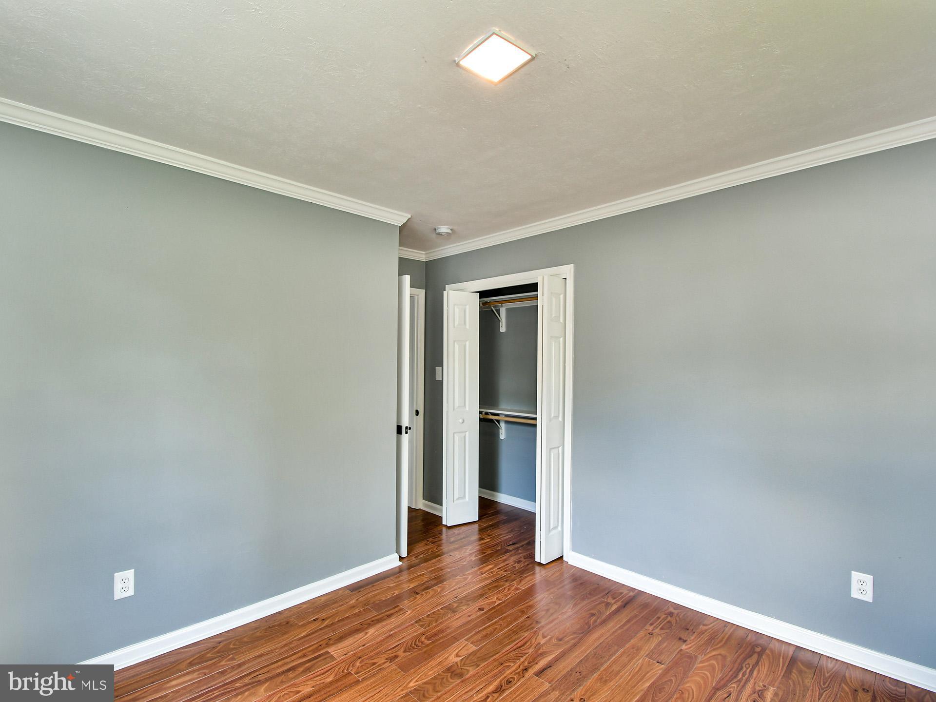9303 Small Drive Clinton, MD 20735 - Photo 26 of 48 a view of an empty room with wooden floor