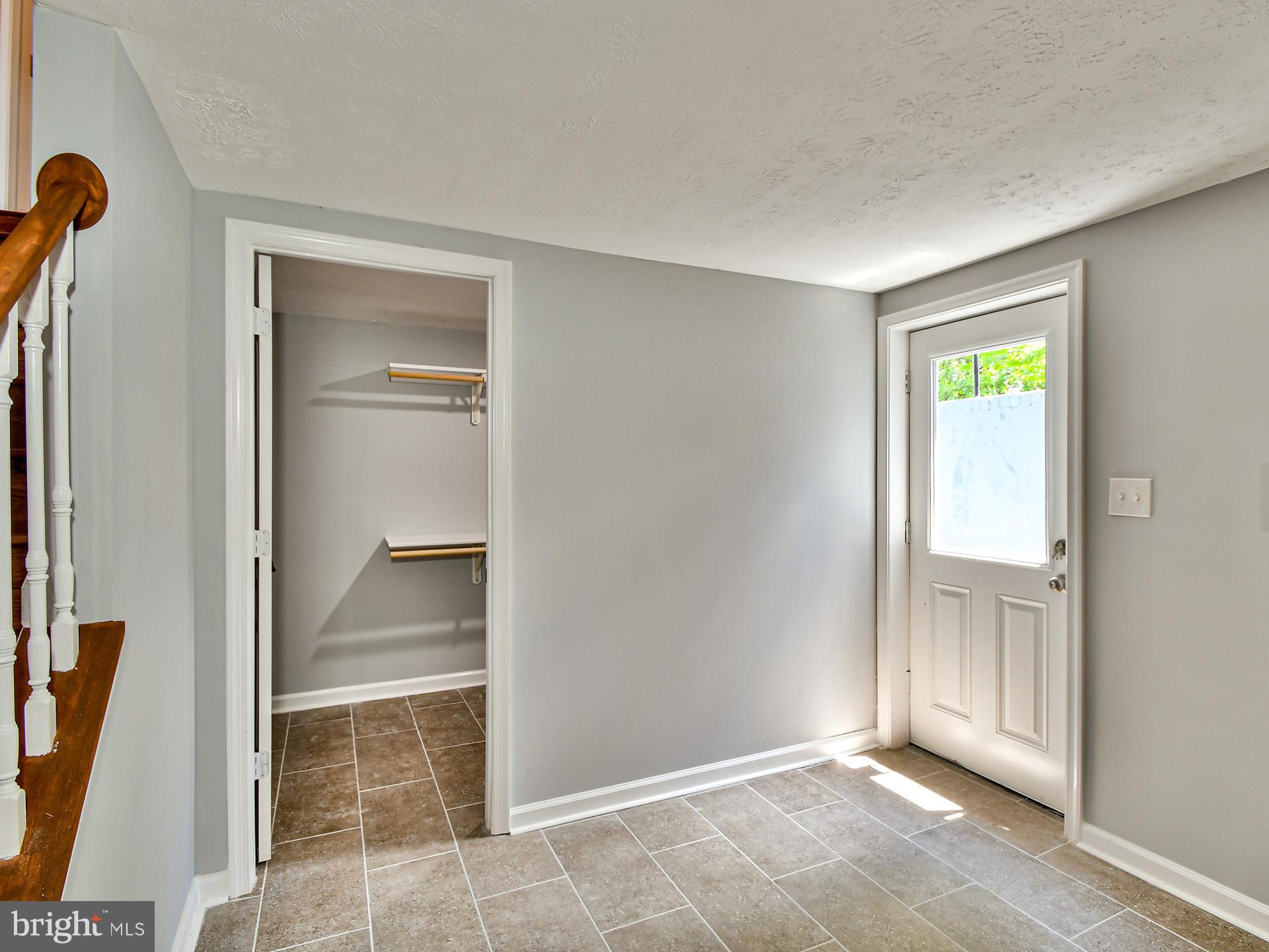 9303 Small Drive Clinton, MD 20735 - Photo 35 of 48 a view of an empty room with glass door