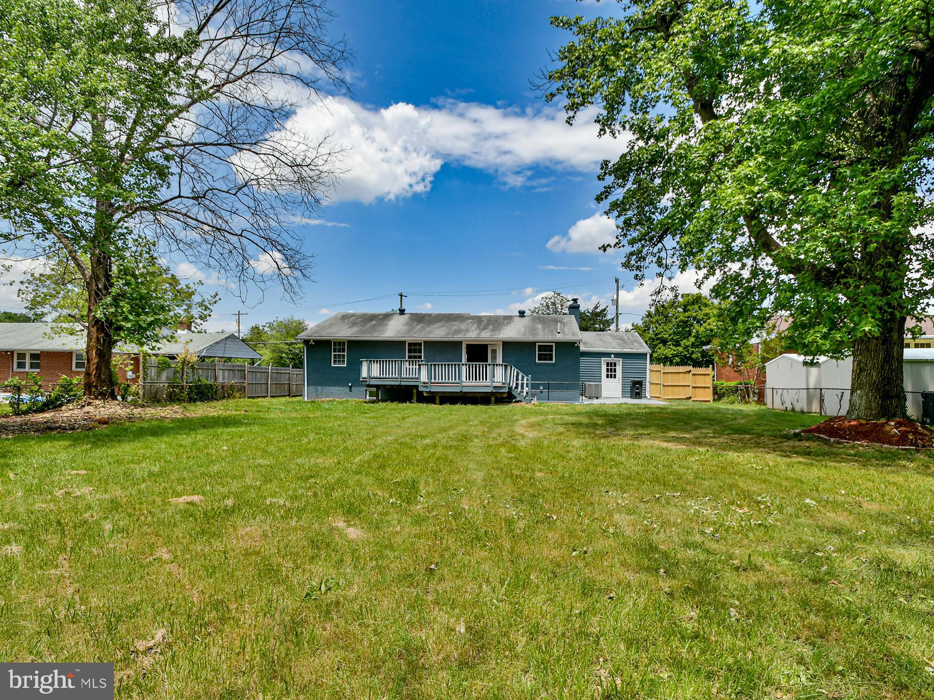 9303 Small Drive Clinton, MD 20735 - Photo 46 of 48 a front view of a house with a garden