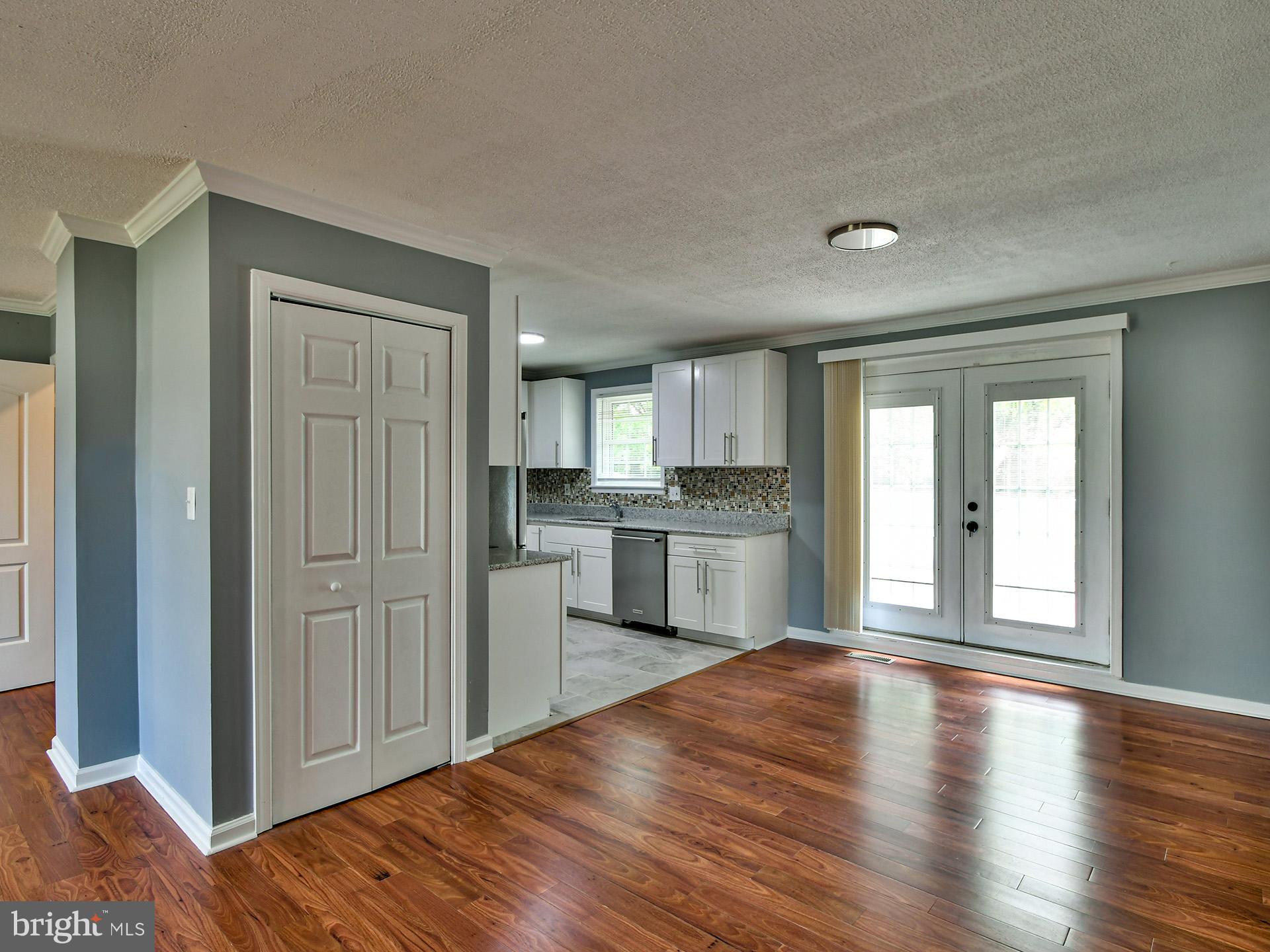 9303 Small Drive Clinton, MD 20735 - Photo 6 of 48 a view of a kitchen with wooden floor and a kitchen