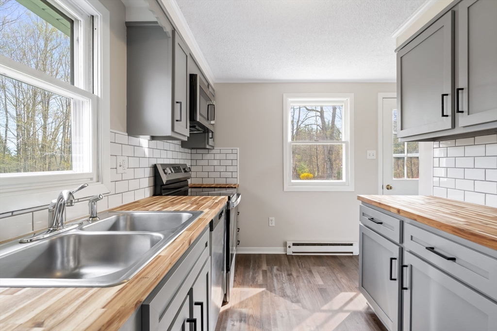67 Bromley Road Huntington, MA 01050 - Photo 17 of 34 a kitchen that has a sink and a stove