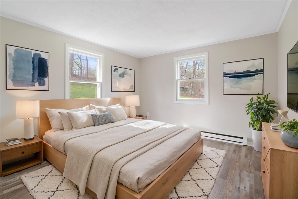 67 Bromley Road Huntington, MA 01050 - Photo 23 of 34 a bedroom with a bed and a painting on the wall