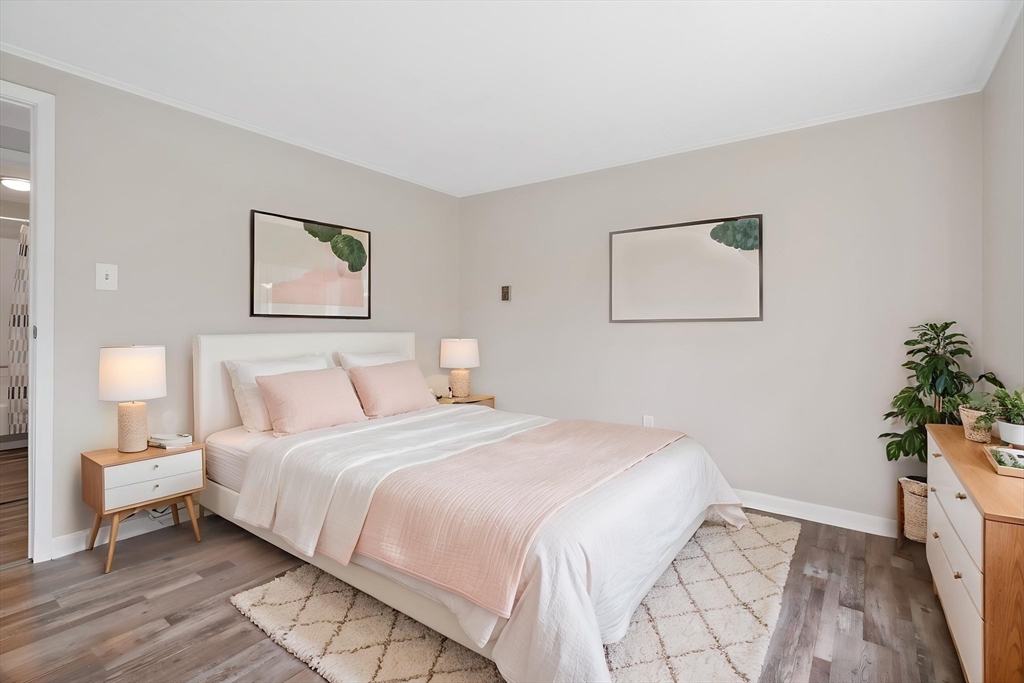 67 Bromley Road Huntington, MA 01050 - Photo 24 of 34 a bedroom with a bed and a potted plant