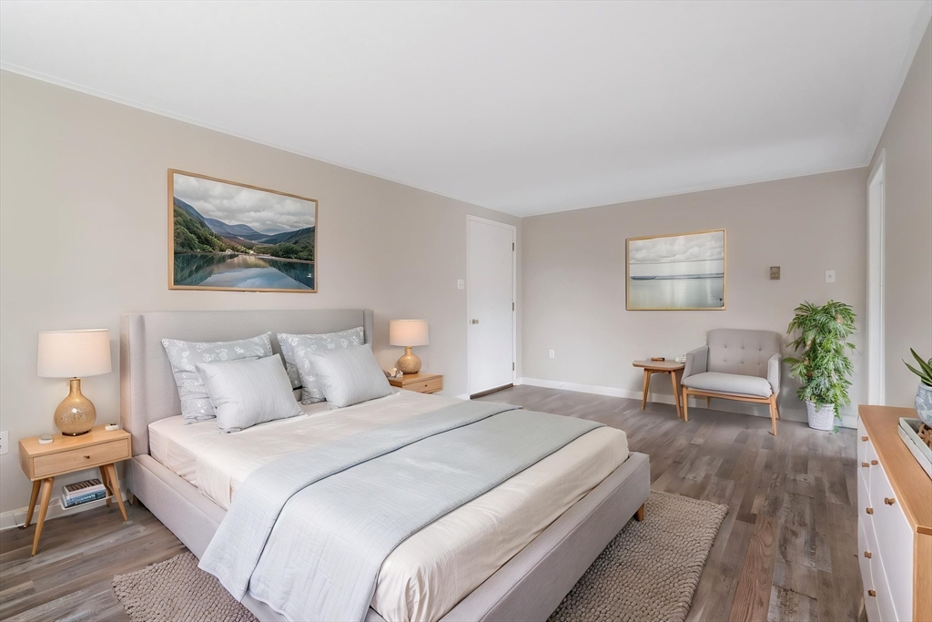 67 Bromley Road Huntington, MA 01050 - Photo 25 of 34 a bedroom with bed and a potted plant