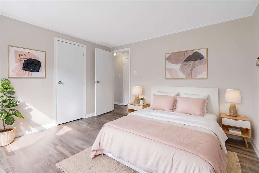 67 Bromley Road Huntington, MA 01050 - Photo 27 of 34 a bedroom with a bed and a potted plant