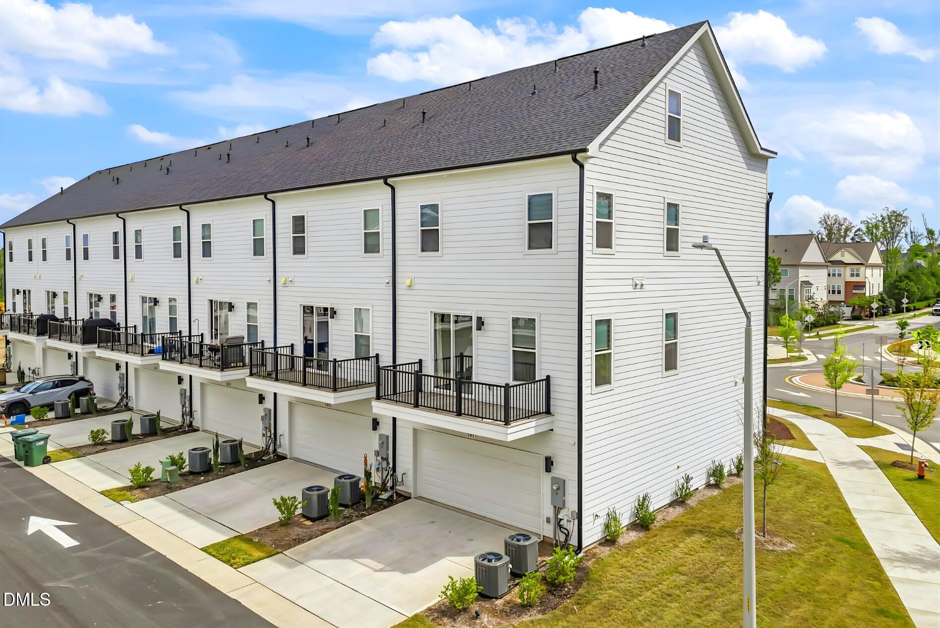 501 Hedrick Ridge Road Cary, NC 27519 - Photo 42 of 47 a view of a balcony with chairs