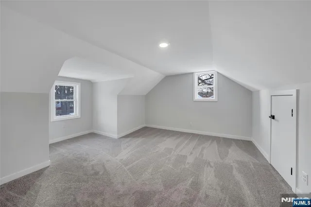 a view of a room with wooden walls