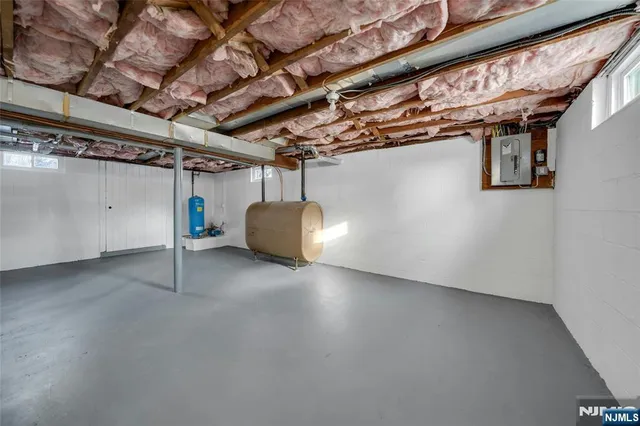 a backyard of a house with oven and barbeque oven