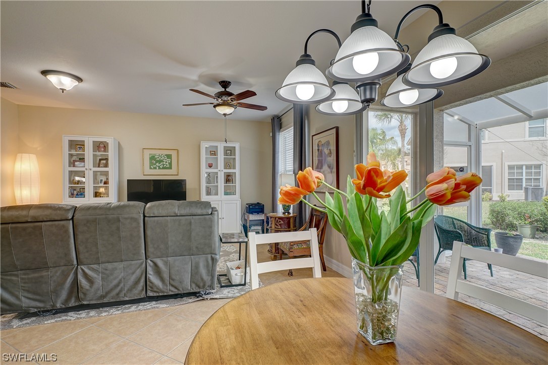 4089 Cherrybrook Loop Fort Myers, FL 33966 - Photo 12 of 35 a living room filled with furniture chandelier and wooden floor