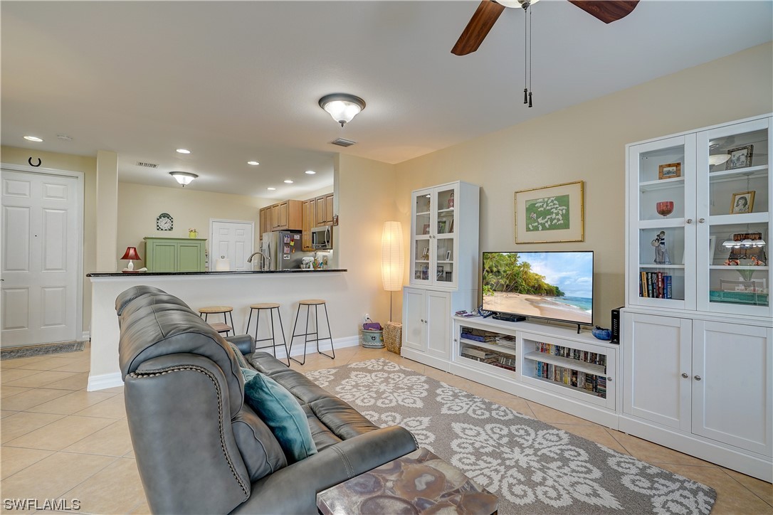 4089 Cherrybrook Loop Fort Myers, FL 33966 - Photo 14 of 35 a living room with furniture and a flat screen tv