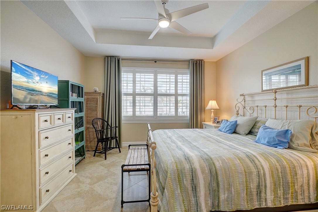 4089 Cherrybrook Loop Fort Myers, FL 33966 - Photo 26 of 35 a bedroom with a bed and a flat screen tv