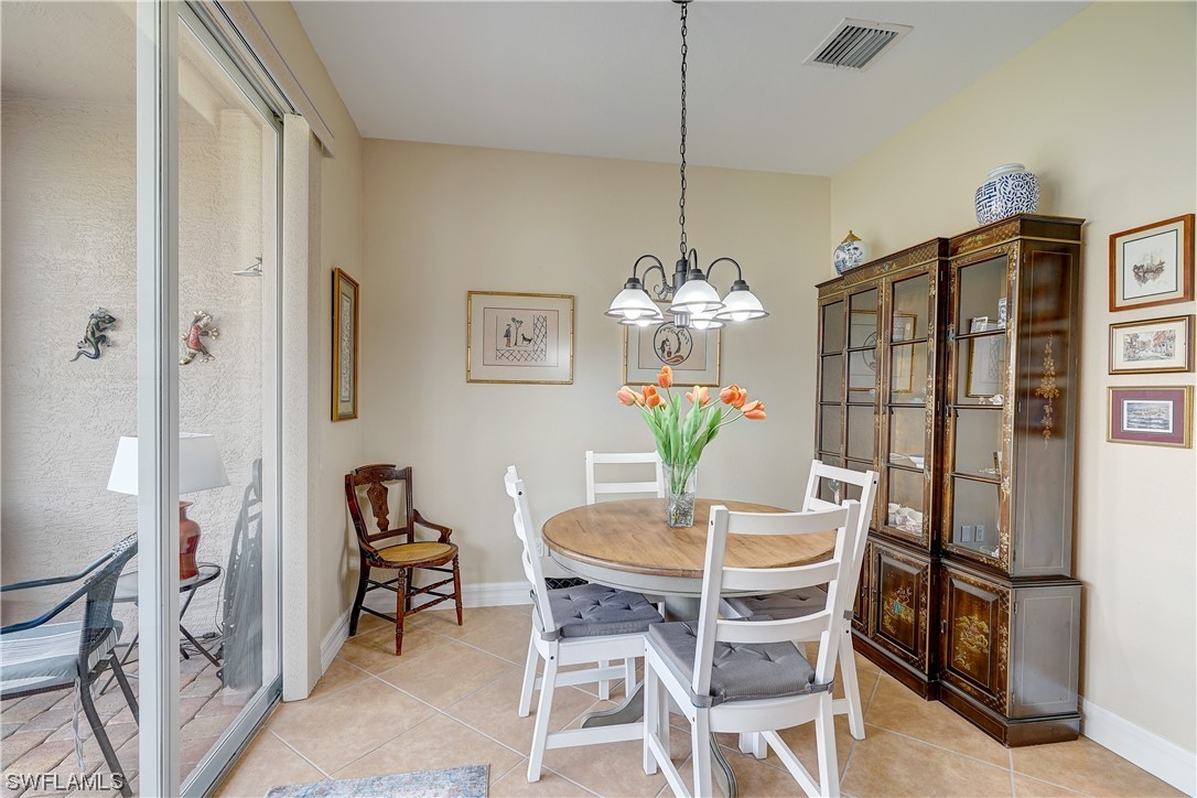 4089 Cherrybrook Loop Fort Myers, FL 33966 - Photo 29 of 35 a view of a dining room with furniture and chandelier