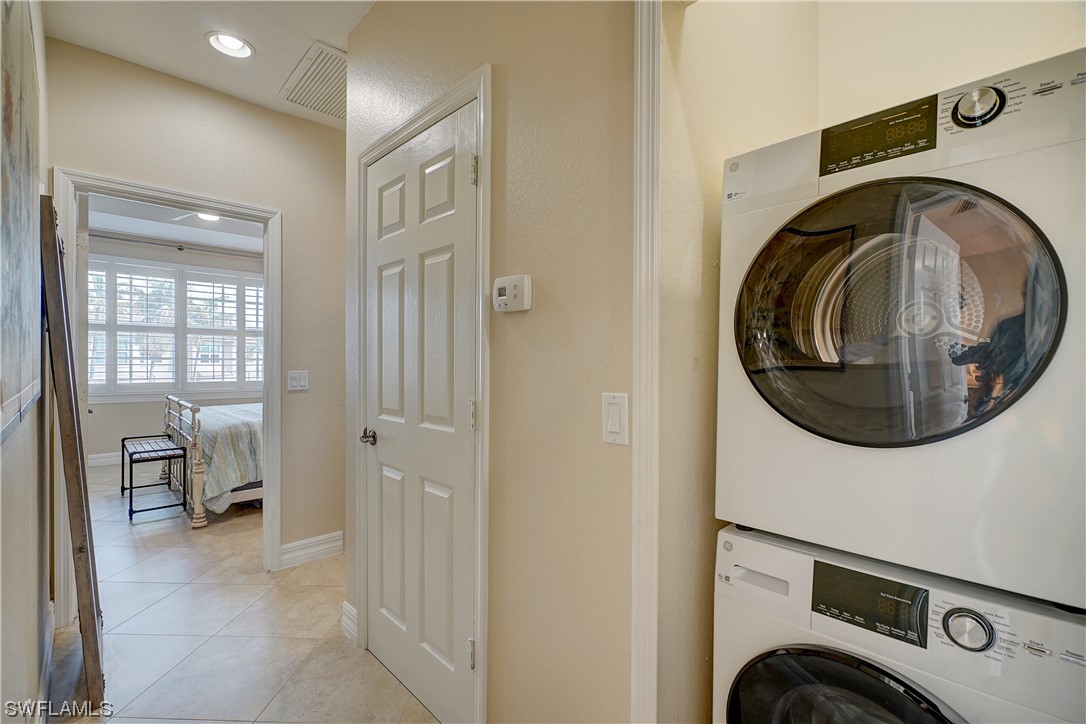 4089 Cherrybrook Loop Fort Myers, FL 33966 - Photo 30 of 35 a view of a storage & utility room with washer and dryer