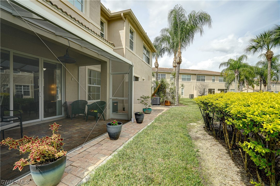 4089 Cherrybrook Loop Fort Myers, FL 33966 - Photo 34 of 35 a view of a house with backyard and sitting area