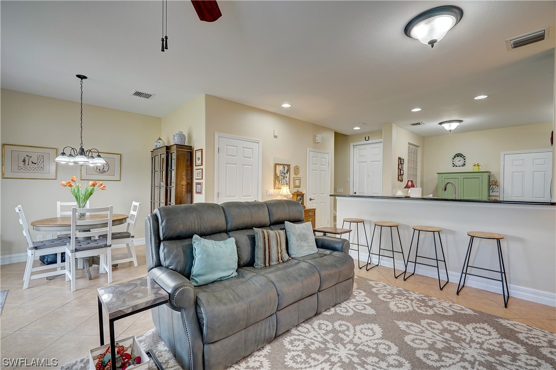 4089 Cherrybrook Loop Fort Myers, FL 33966 - Photo 10 of 35 a living room with furniture and a wooden floor