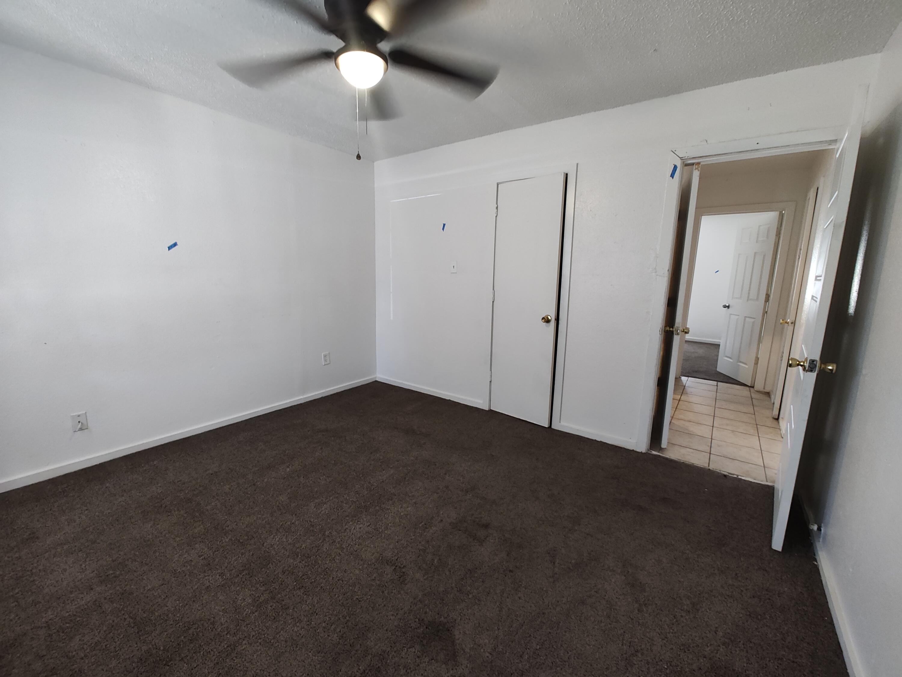 1803 49th Street Lubbock, TX 79412 - Photo 11 of 12 an empty room with a mirror
