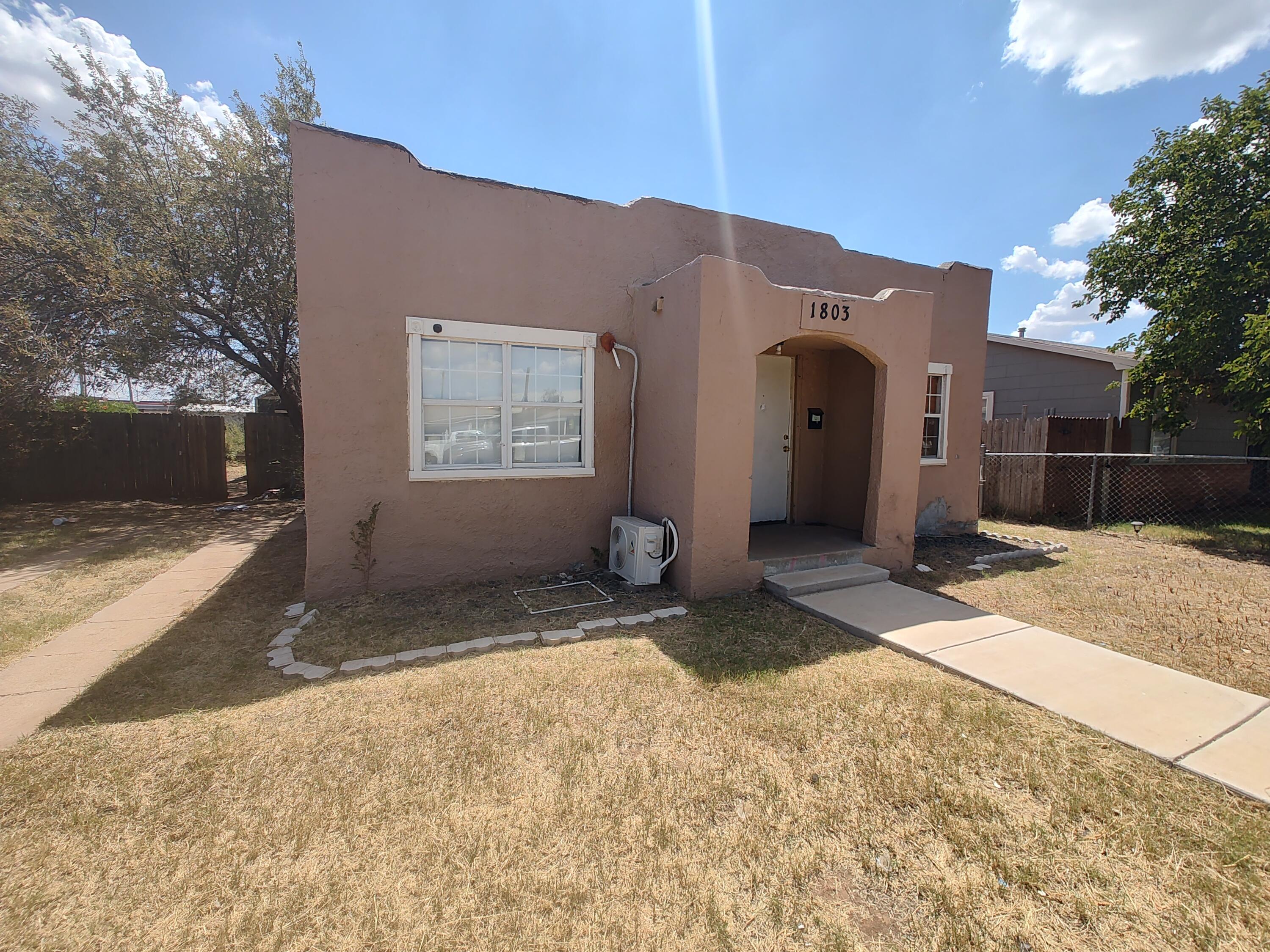 1803 49th Street Lubbock, TX 79412 - Photo 3 of 12 a view of a house with a yard