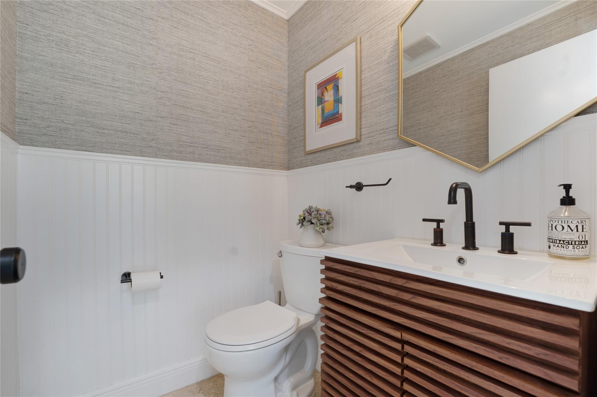 741 Mockingbird Lane Plantation, FL 33324 - Photo 16 of 59 a bathroom with a sink and a toilet