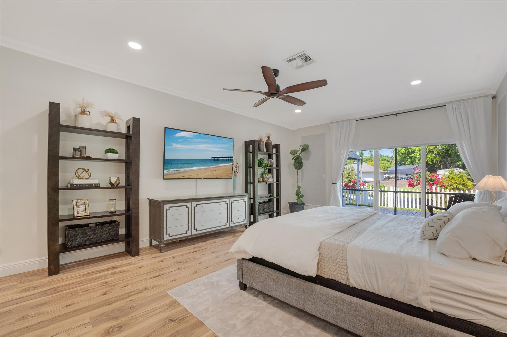 741 Mockingbird Lane Plantation, FL 33324 - Photo 18 of 59 a bedroom with a large bed and a large window