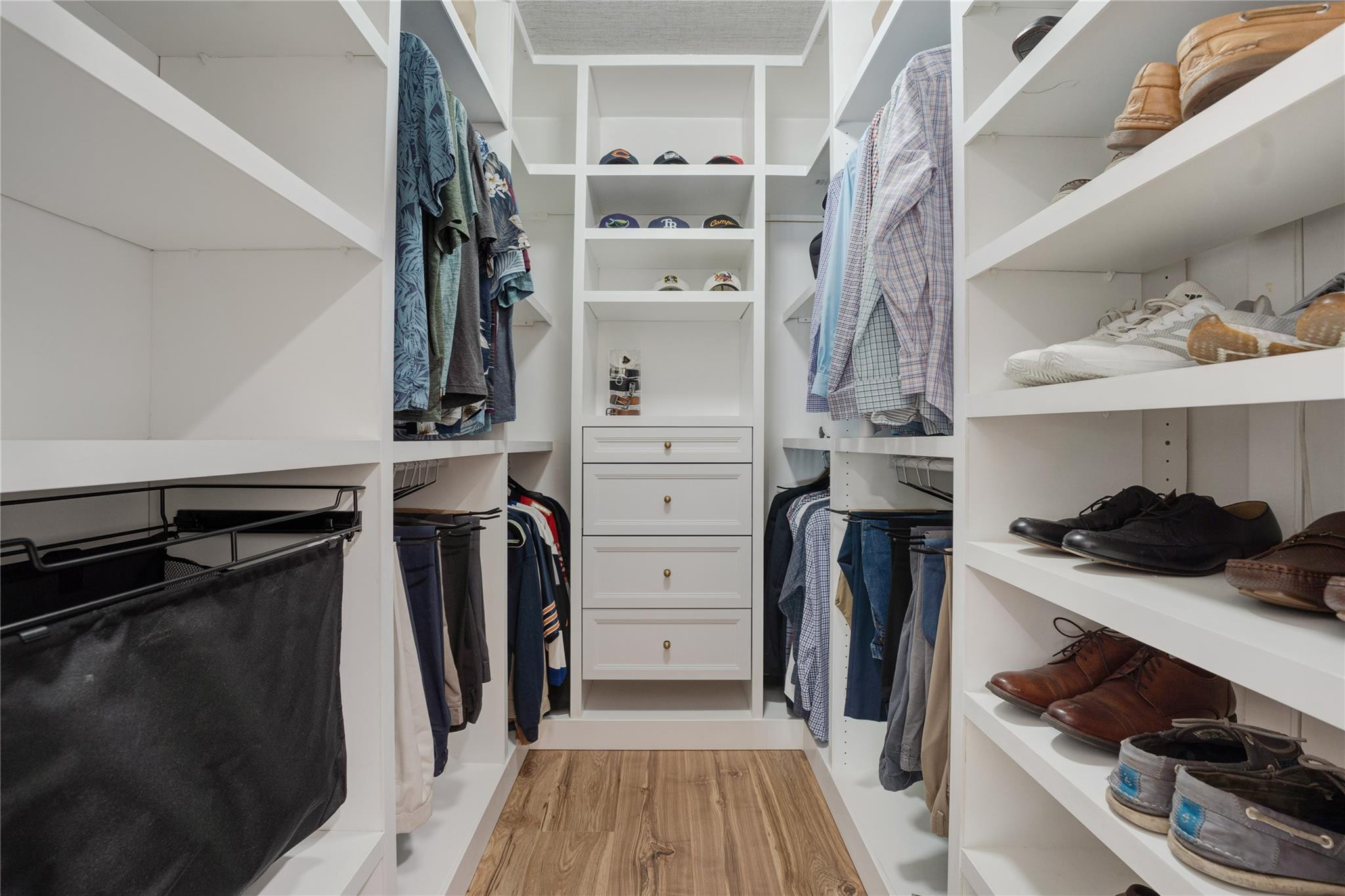 741 Mockingbird Lane Plantation, FL 33324 - Photo 19 of 59 a view of walk in closet with clothes and shoes