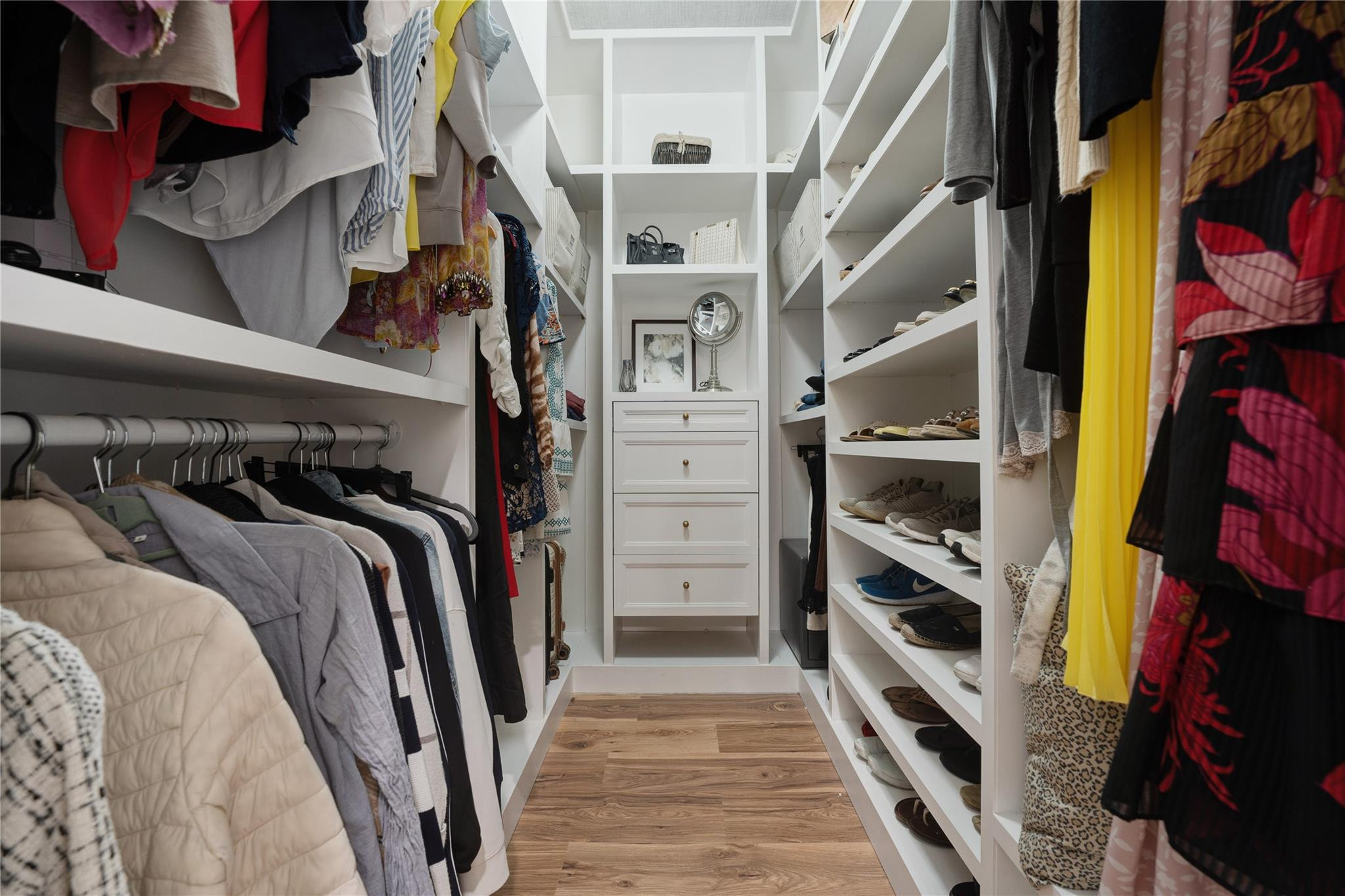 741 Mockingbird Lane Plantation, FL 33324 - Photo 20 of 59 a view of walk in closet with clothes and shoes