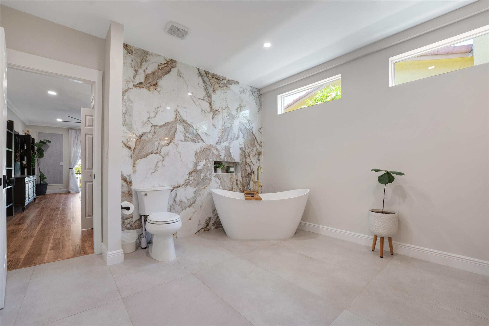 741 Mockingbird Lane Plantation, FL 33324 - Photo 21 of 59 a bathroom with a bathtub and toilet