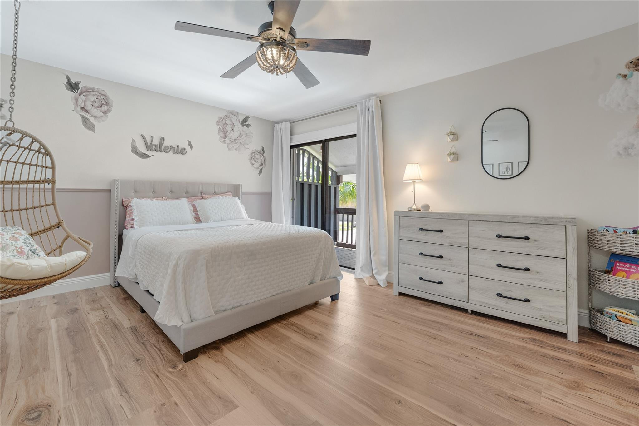 741 Mockingbird Lane Plantation, FL 33324 - Photo 29 of 59 a bedroom with a large bed and a chandelier