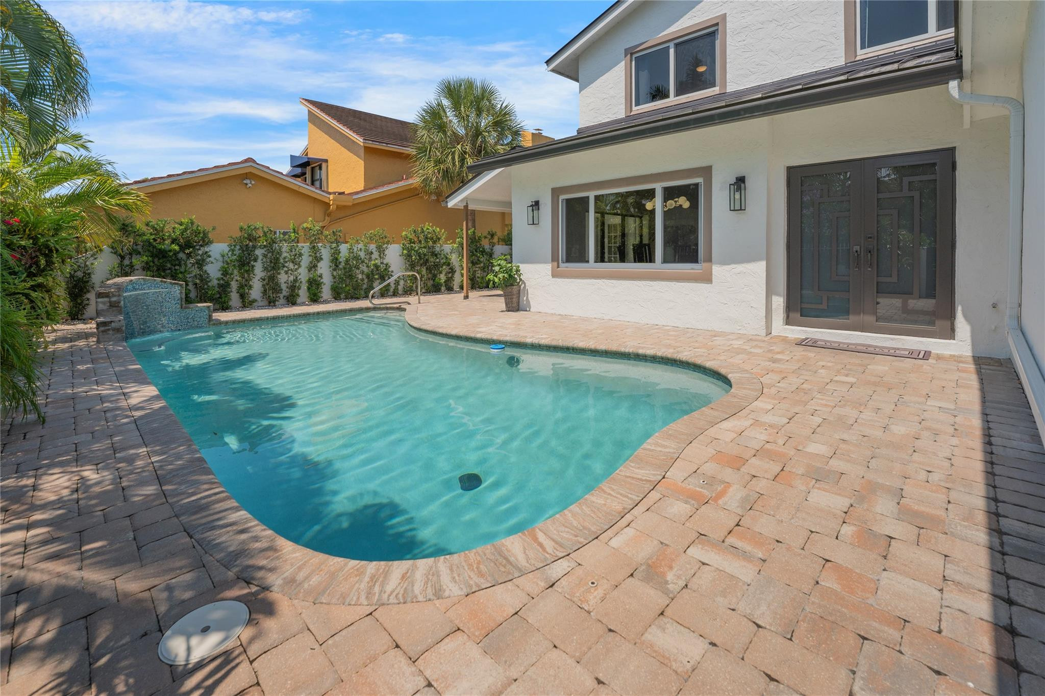 741 Mockingbird Lane Plantation, FL 33324 - Photo 41 of 59 a view of a white house with a yard potted plants