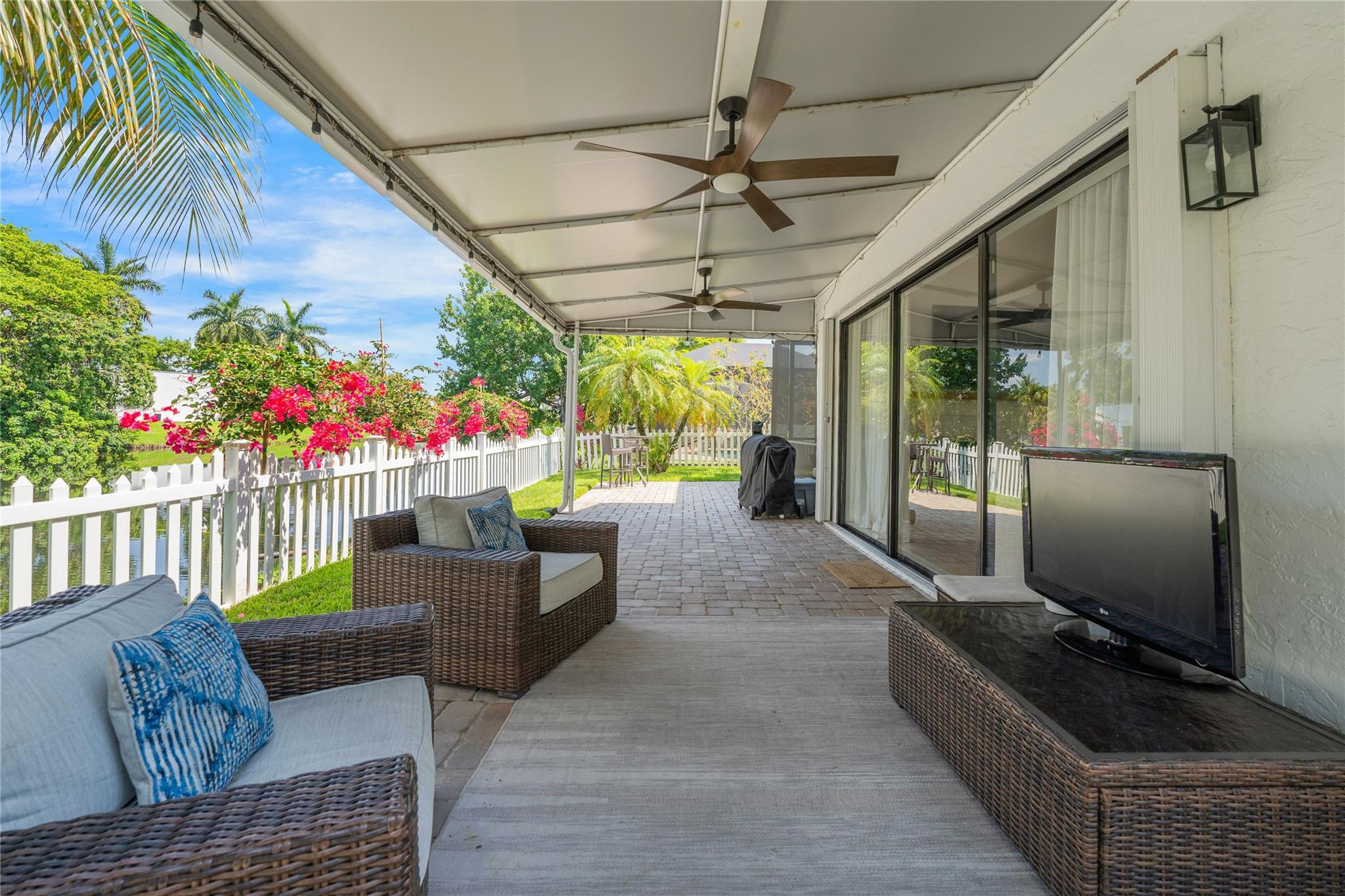 741 Mockingbird Lane Plantation, FL 33324 - Photo 46 of 59 a living room with furniture and a flat screen tv