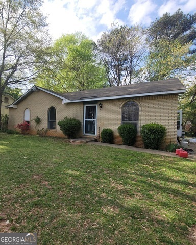 a house view with a garden space