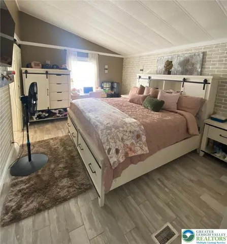 a bed room with a bed and a couch