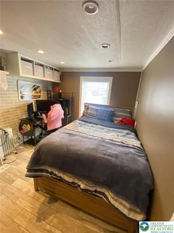 a bed room with a bed and a window