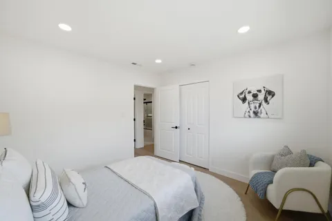 a bedroom with a bed and furniture
