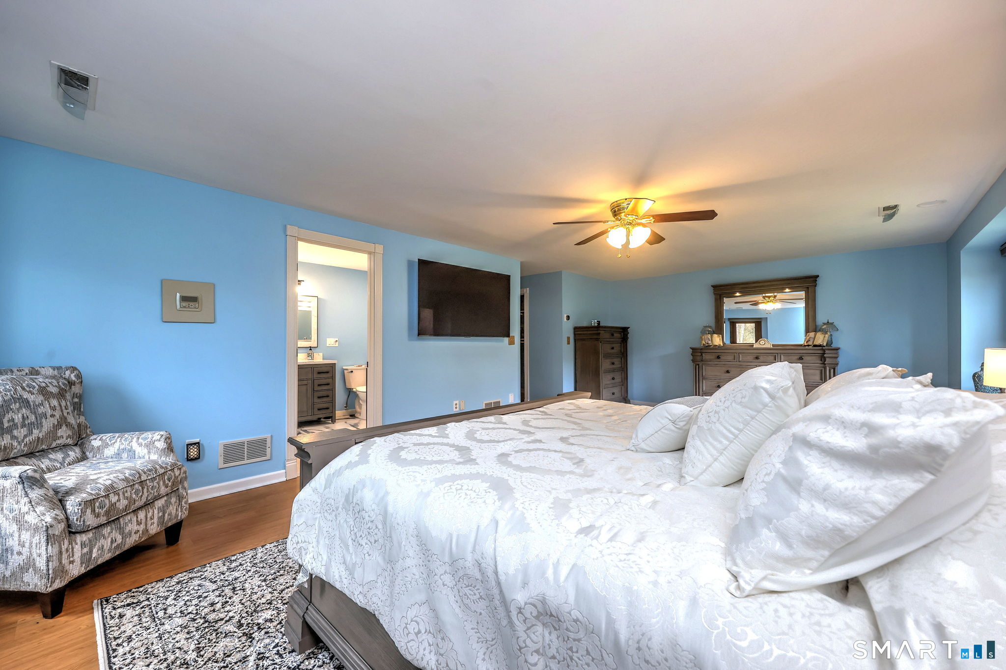 2262 Ridge Road North Haven, CT 06473 - Photo 7 of 40 a bedroom with a bed and a couch