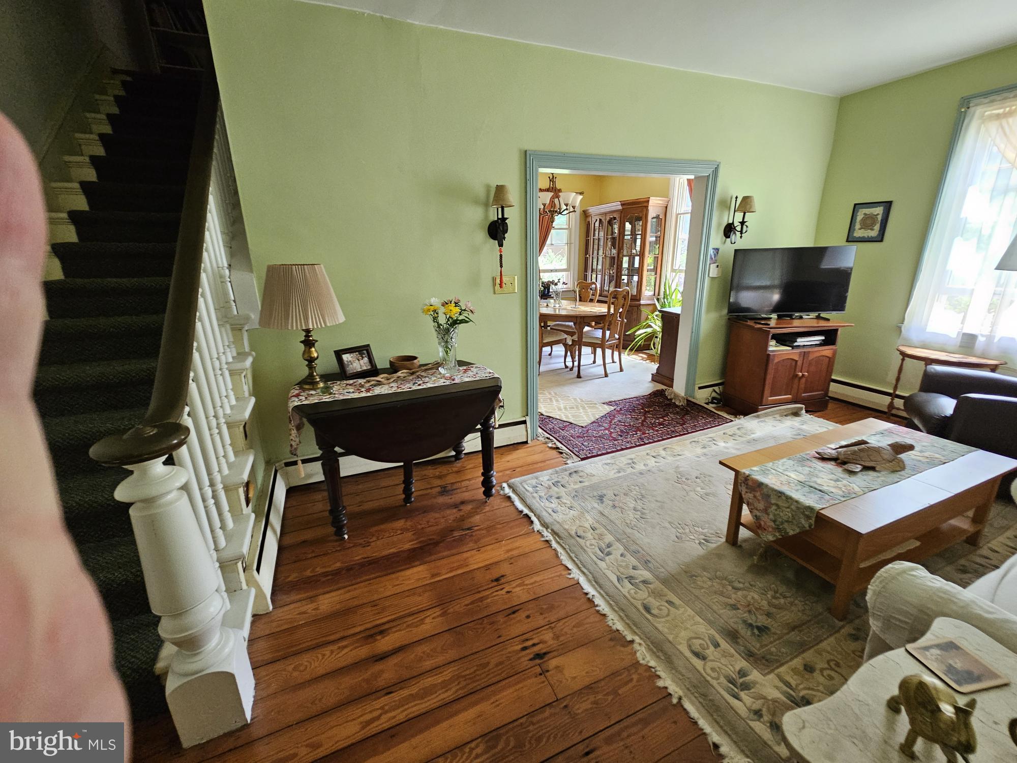 9039 Easton Road Ottsville, PA 18942 - Photo 7 of 61 a living room with furniture and a flat screen tv