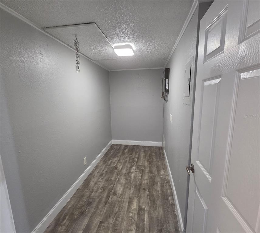 1400 Strawberry Place, Unit 6 Plant City, FL 33563 - Photo 5 of 11 a view of a room with wooden floor and staircase