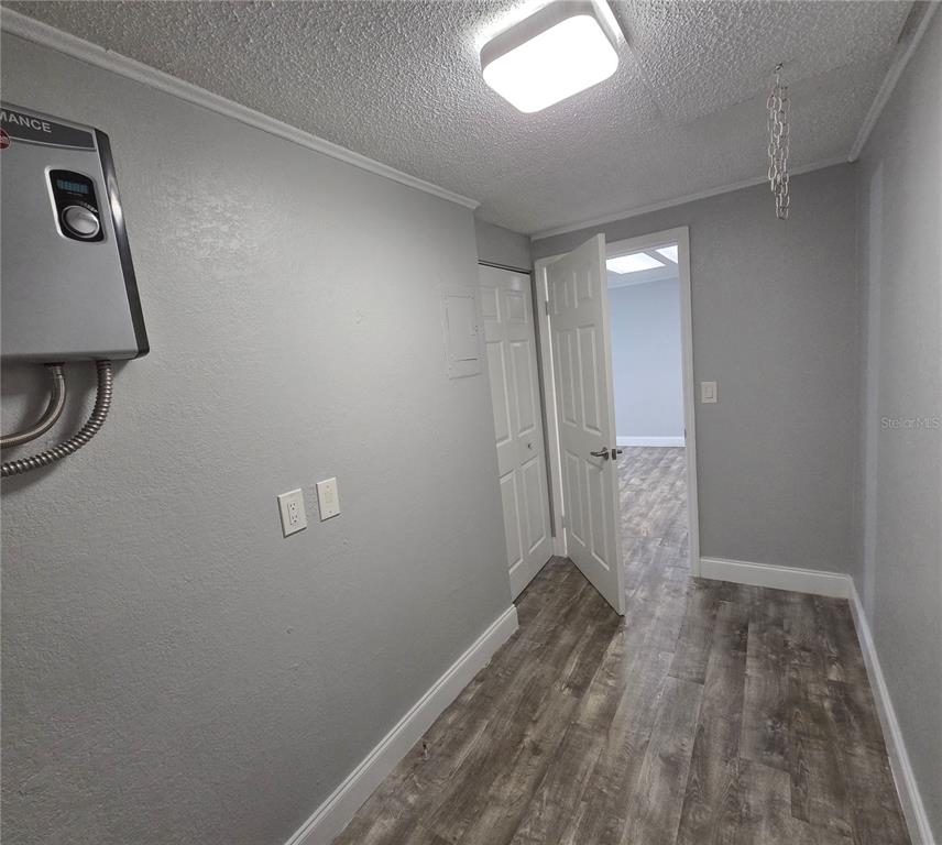 1400 Strawberry Place, Unit 6 Plant City, FL 33563 - Photo 6 of 11 wooden floor in an empty room
