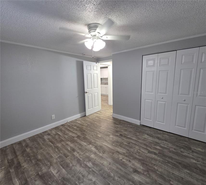 1400 Strawberry Place, Unit 6 Plant City, FL 33563 - Photo 9 of 11 a view of an empty room with wooden floor