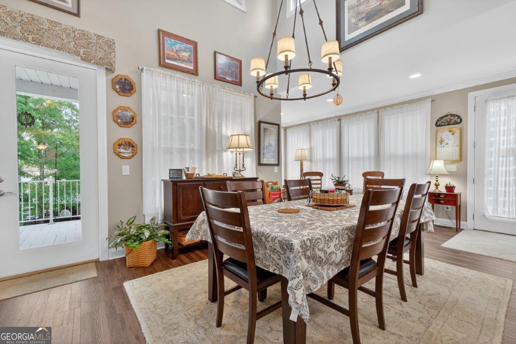 281 Jule Ingram Road Milledgeville, GA 31061 - Photo 16 of 79 a view of a dining room with furniture window and wooden floor