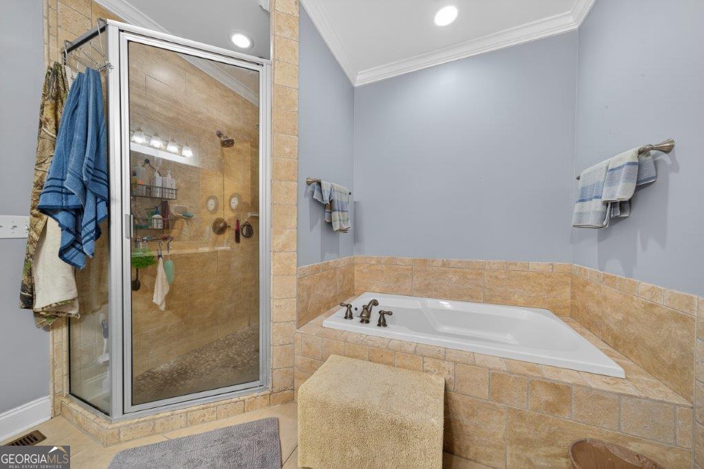 281 Jule Ingram Road Milledgeville, GA 31061 - Photo 25 of 79 a bathroom with a bathtub and shower
