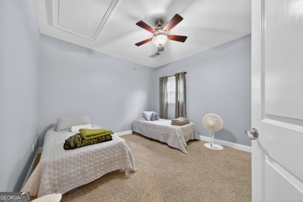 281 Jule Ingram Road Milledgeville, GA 31061 - Photo 29 of 79 a bedroom with bed and window