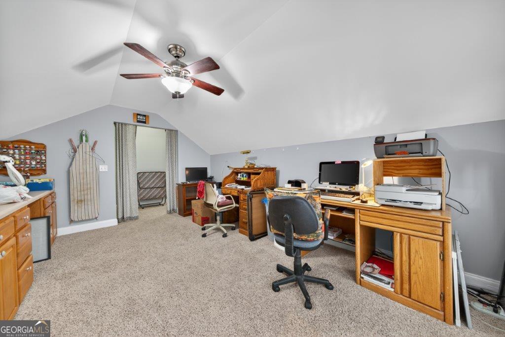 281 Jule Ingram Road Milledgeville, GA 31061 - Photo 32 of 79 a view of a workspace with furniture and a ceiling fan