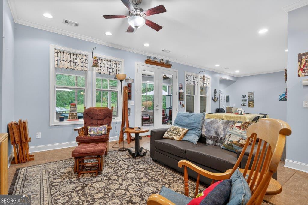281 Jule Ingram Road Milledgeville, GA 31061 - Photo 41 of 79 a living room with furniture and a window