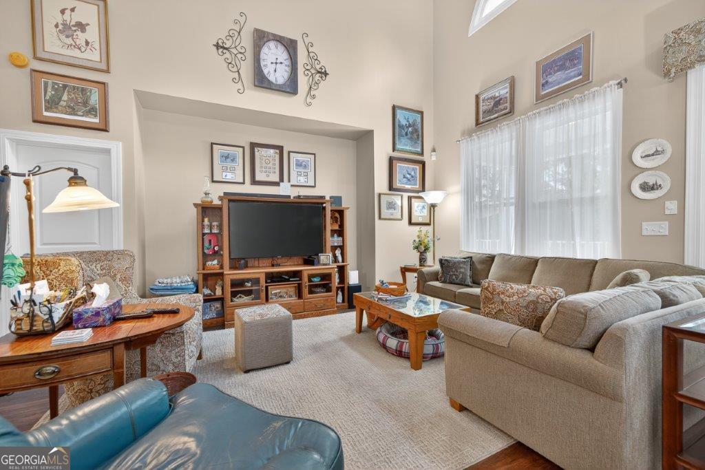 281 Jule Ingram Road Milledgeville, GA 31061 - Photo 5 of 79 a living room with furniture and a flat screen tv