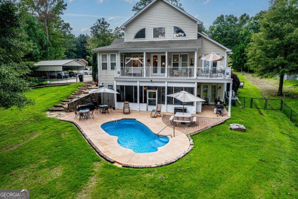 281 Jule Ingram Road Milledgeville, GA 31061 - Photo 68 of 79 a house with garden in front of it