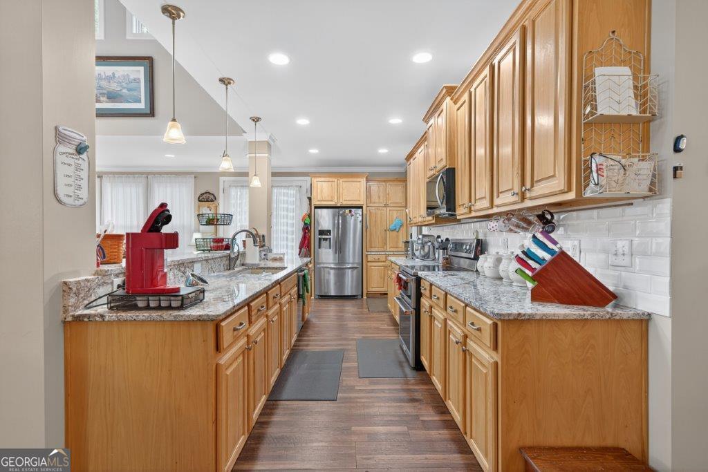 281 Jule Ingram Road Milledgeville, GA 31061 - Photo 8 of 79 a kitchen with stainless steel appliances granite countertop a sink and cabinets