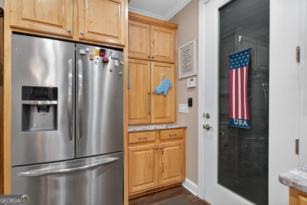 281 Jule Ingram Road Milledgeville, GA 31061 - Photo 10 of 79 a metallic refrigerator freezer sitting in a kitchen