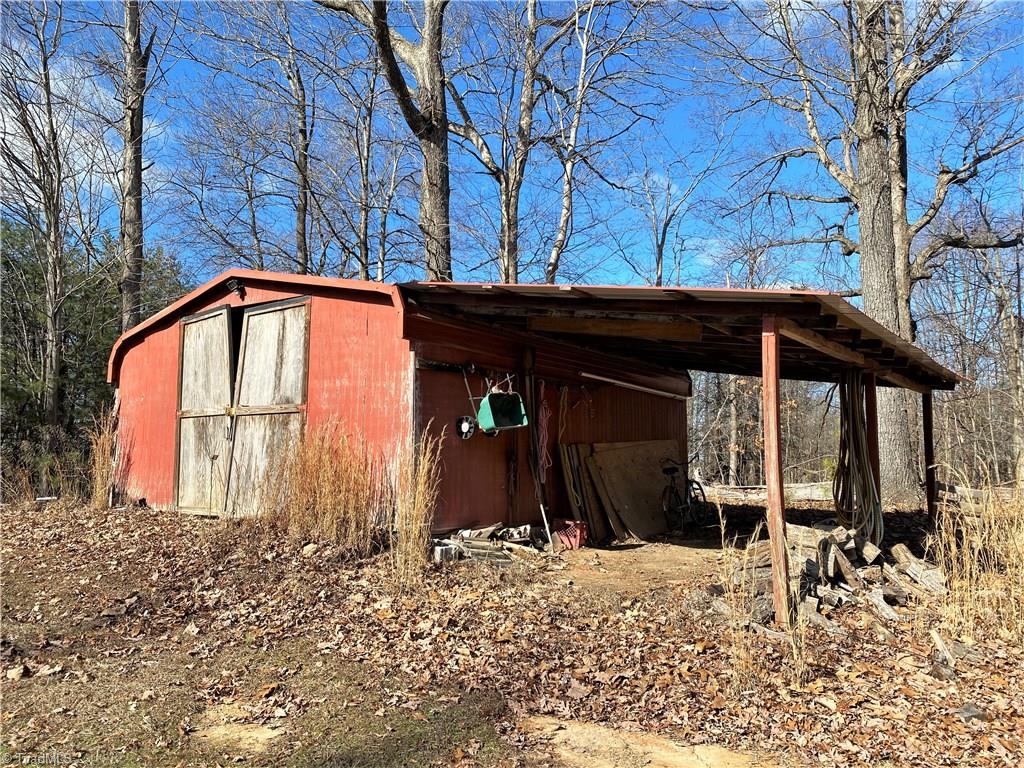 493 Bennett Farm Road Stokesdale, NC 27357 - Photo 22 of 30 Shed or storage building with lean-to